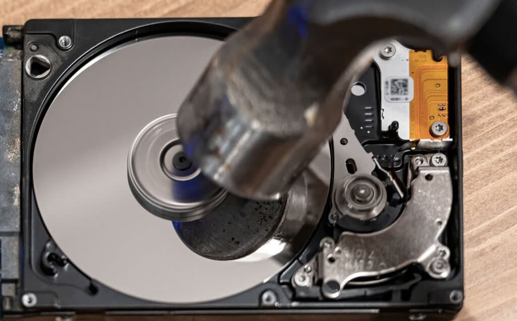 Smashing hard drive with hammer